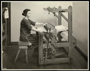 Blind woman working at a loom at the New York Association for the Blind, 111 East 59th Street, New York